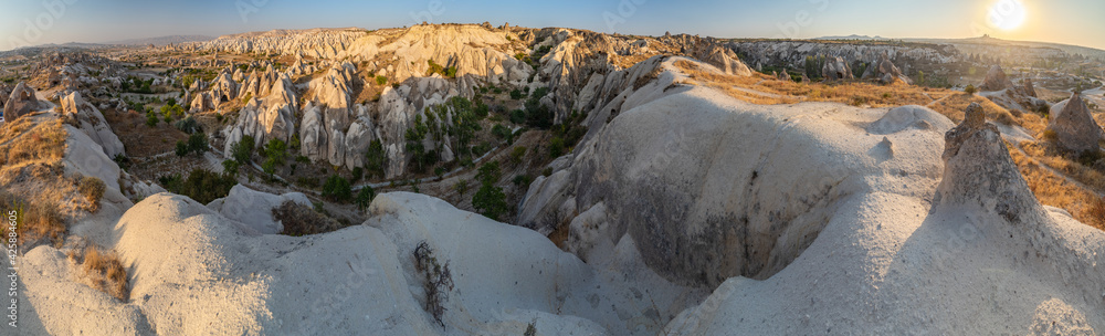 The picturesque panorama of Cappadocia at sunset, amazing Turkey, Mountains and rock formation, big size image, Goreme national park, Love valley, open air museum, ancient region of Anatolia, Unesco The picturesque panorama of Cappadocia at sunset, amazing Turkey, Mountains and rock formation, big size image, Goreme national park, Love valley, open air museum, ancient region of Anatolia, Unesco