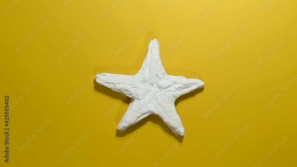Plaster starfish on yellow background. Plaster starfish on yellow background.