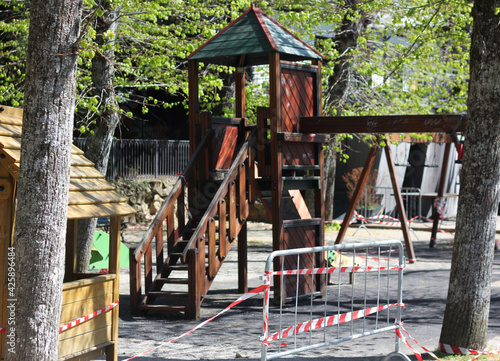 playground for children closed on quarantine and repaired with protective tape 