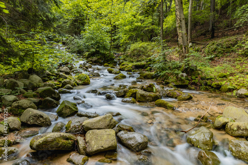 Small stony waterfall next to mountain trail in Giant Mountains