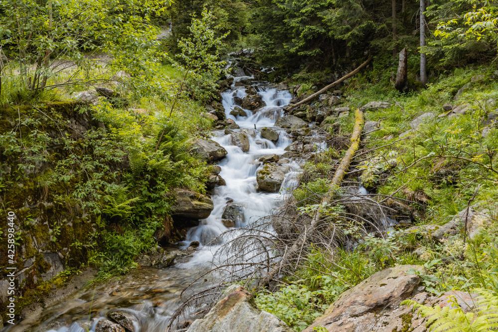 Small stony waterfall next to mountain trail in Giant Mountains Small stony waterfall next to mountain trail in Giant Mountains