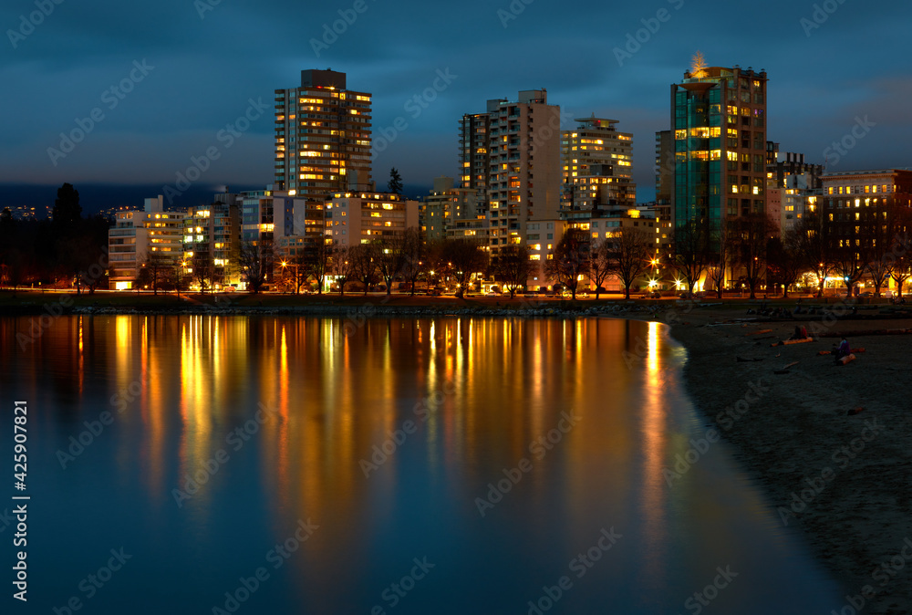 English Bay Beach Night. Towers on Beach Avenue at twilight on English Bay, Vancouver.

