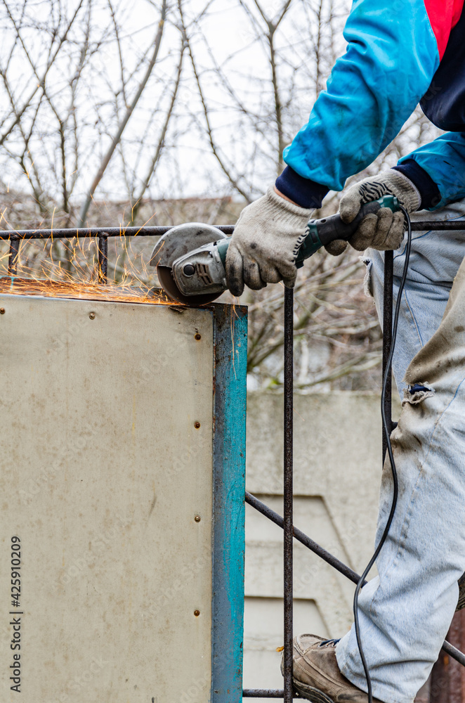 Work with an electric cut-off, grinder in a garage. Gate repair. Work with an electric cut-off, grinder in a garage. Gate repair.