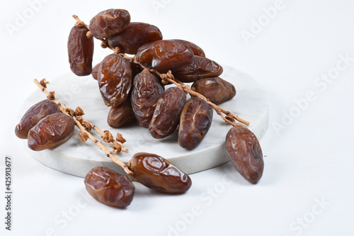 sweet dried palm fruit isolated on white background.