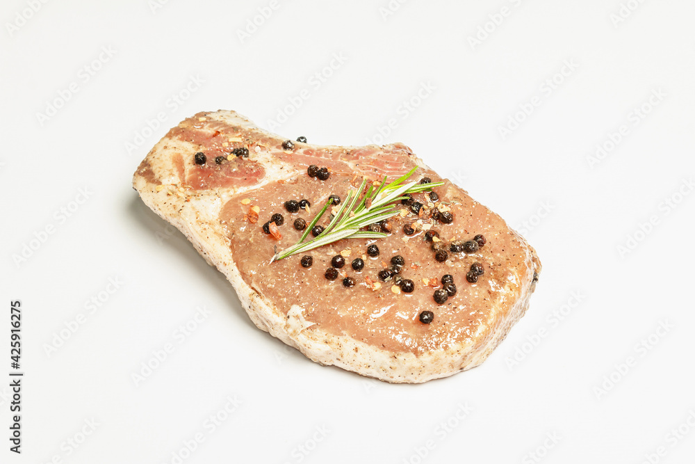 Raw pork loin steak isolated on white background