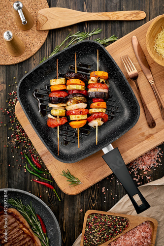 Grilled vegetables in a frying pan in a rustic kitchen. High quality photo