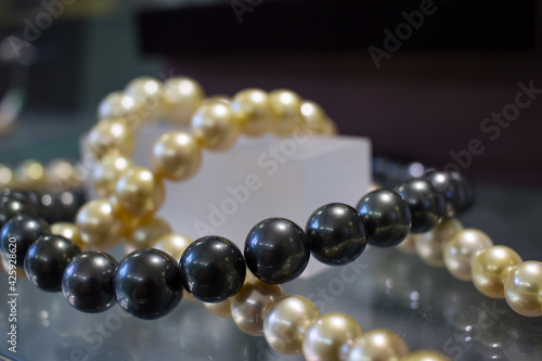 Black and gold cultured south sea pearls.