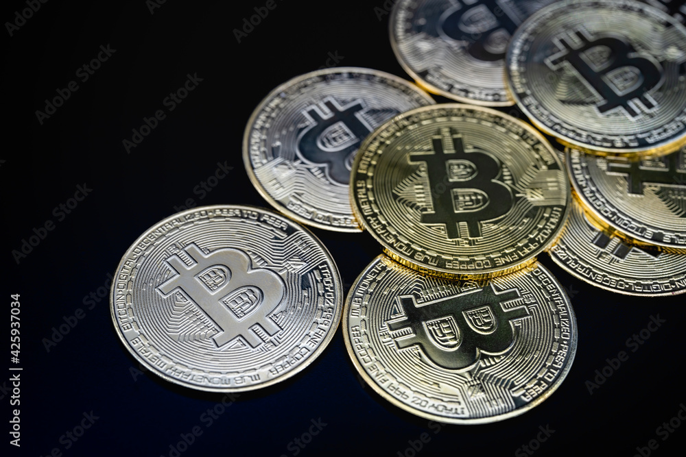 Business , Money, Technology and cryptocurrency Concept. Closeup pile of bitcoin coins on black background. Business , Money, Technology and cryptocurrency Concept. Closeup pile of bitcoin coins on black background.