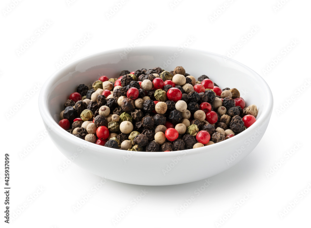 Pepper mix. Black, red, white, and green peppercorn on a white background. Pepper mix. Black, red, white, and green peppercorn on a white background.