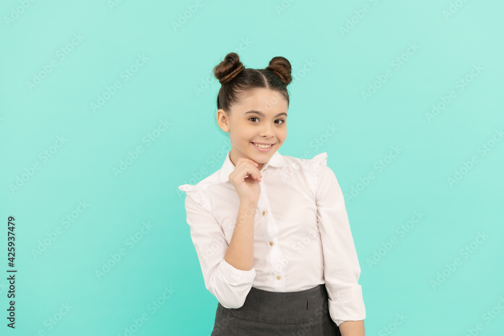 Happy girl child back to school blue background, schoolgirl Happy girl child back to school blue background, schoolgirl