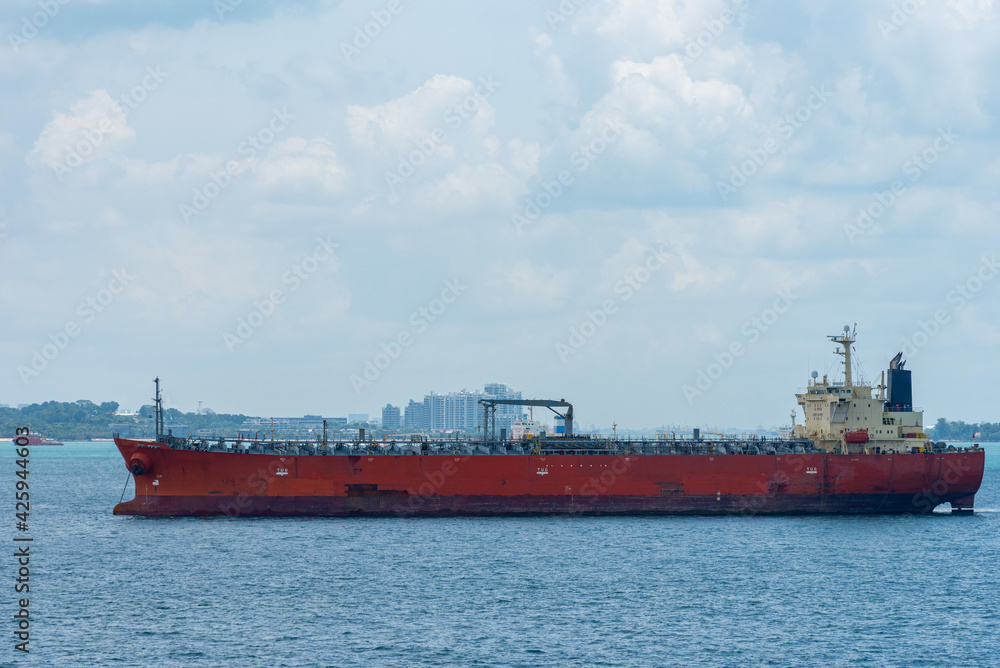 Oil tanker ship anchored in front of the Singapore downtown. 