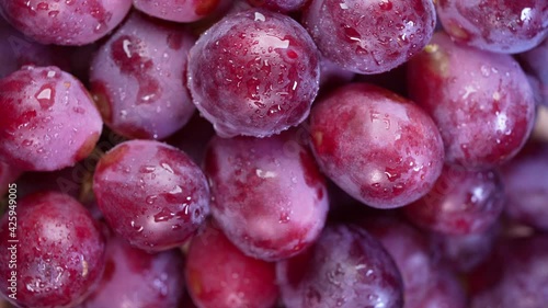 Top view Red grape fruit with slices closeup, Fresh Red grape fruit with green leaves.