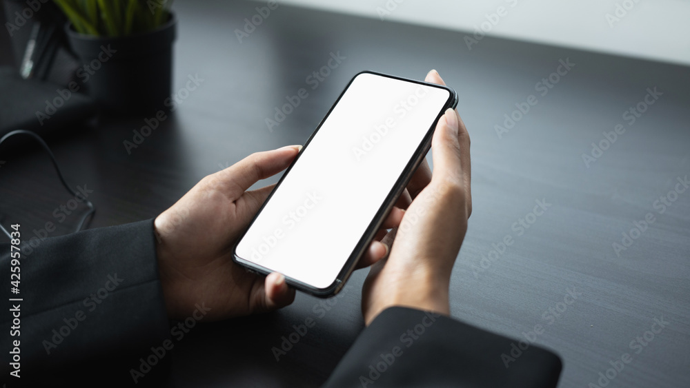 Mock up image of businesswoman holding smart phone with white screen. Blank screen for advertise text. Mock up image of businesswoman holding smart phone with white screen. Blank screen for advertise text.