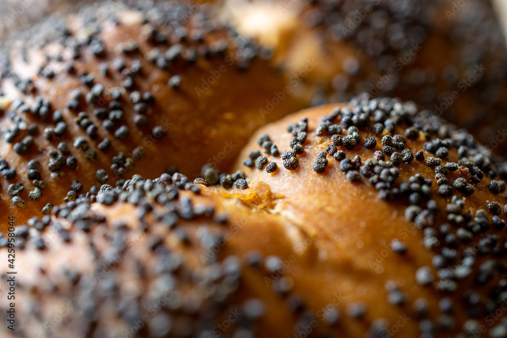 Whole wheat bread. Fresh loaf of rustic traditional bread with wheat poppy seeds in pattern of macro photography. Rye bakery with crusty loaves and crumbs. Homemade baking. Whole wheat bread. Fresh loaf of rustic traditional bread with wheat poppy seeds in pattern of macro photography. Rye bakery with crusty loaves and crumbs. Homemade baking.