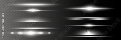 yellow horizontal lens flares pack. Laser beams, horizontal light rays. Beautiful light flares. Glowing streaks on dark background. Luminous abstract sparkling lined background.