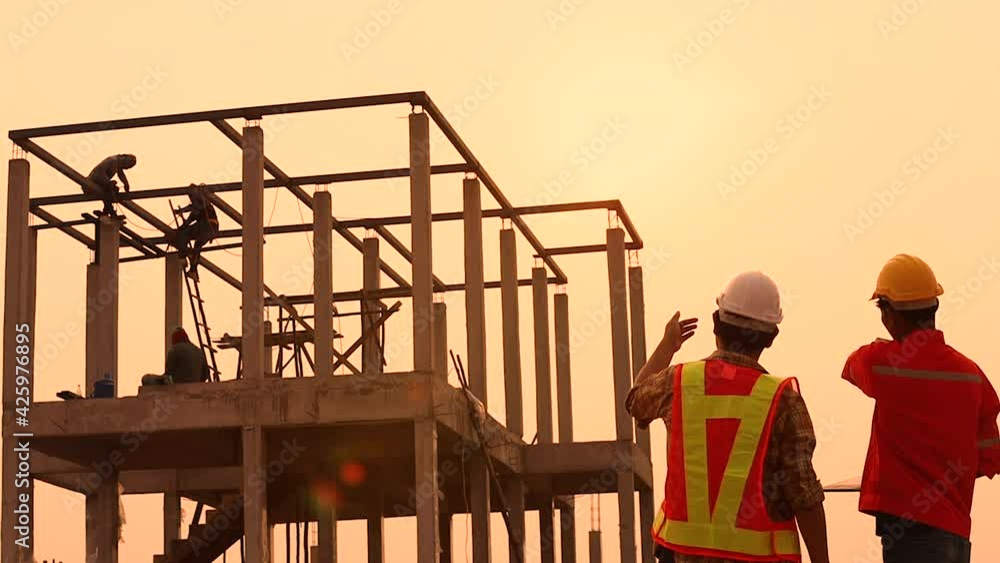 The foreman is inspecting the construction site.