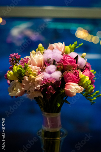 wedding bouquet of various flowers. the buds are pink  purple  green  cotton. spring and bloom. bokeh  night lights. out-focus