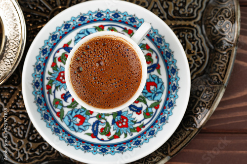 Cup of coffee in oriental style on metal tray © fotofabrika