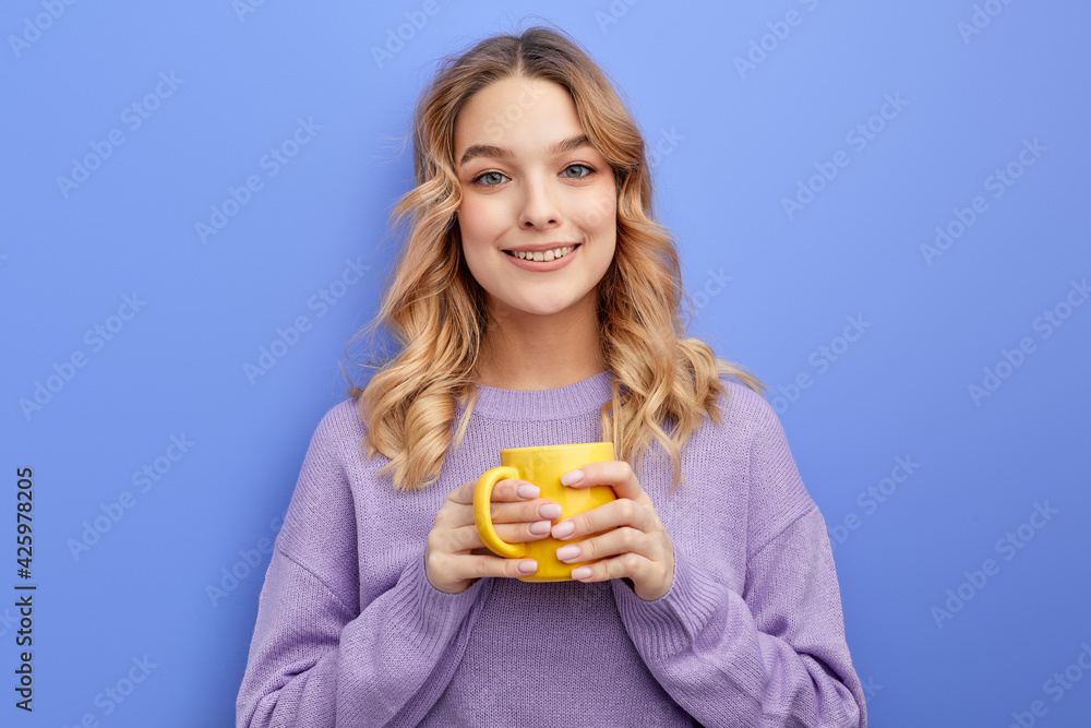 cute positive girl drinking coffee or tea in morning before school or university cute positive girl drinking coffee or tea in morning before school or university