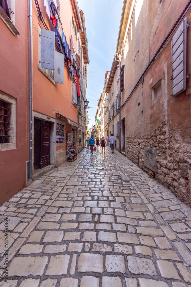 Rovinj, Croatia - August 17 2019: Cobblestone street in the historic heart of Rovinj