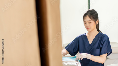 Beautiful Asian female nurse in a beauty clinic.