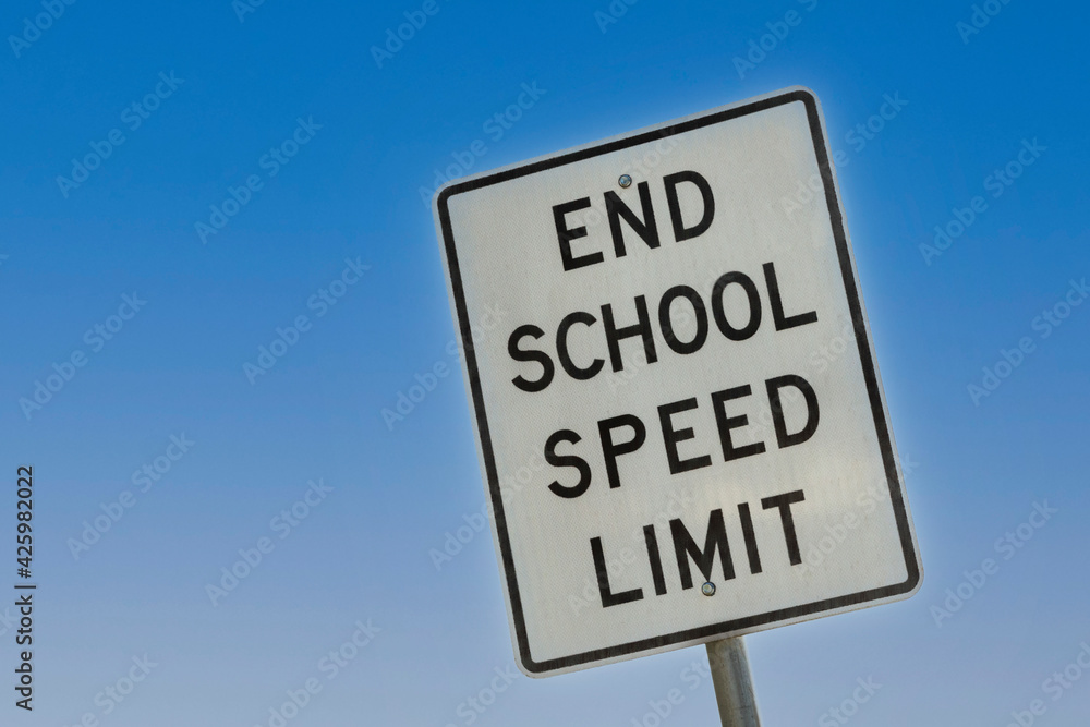 End of School Speed Limit sign with clear blue sky in background