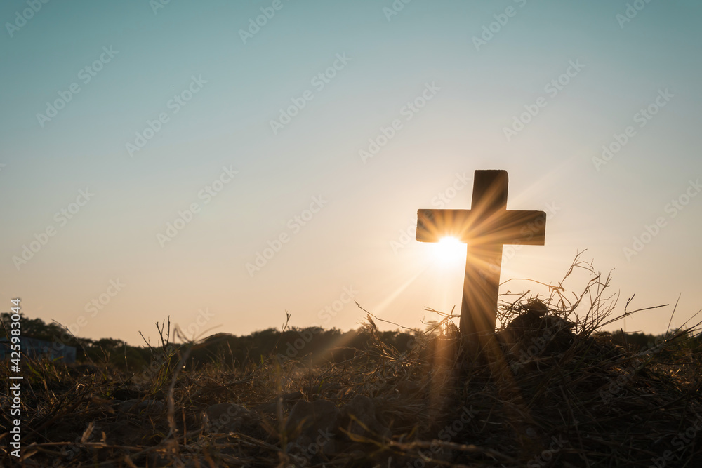 Silhouette jesus christ crucifix on cross on calvary sunset background