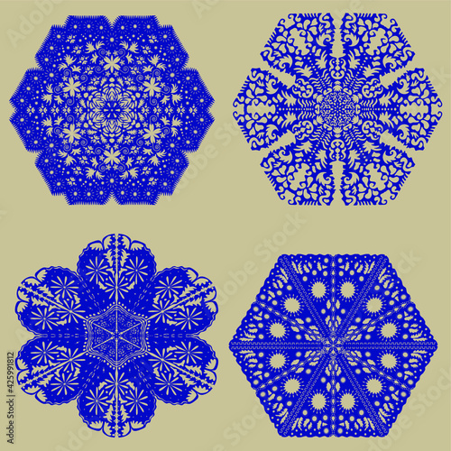 Collection of blue silhouettes of snowflakes on a beige background. Winter composition. Christmas, New Year.