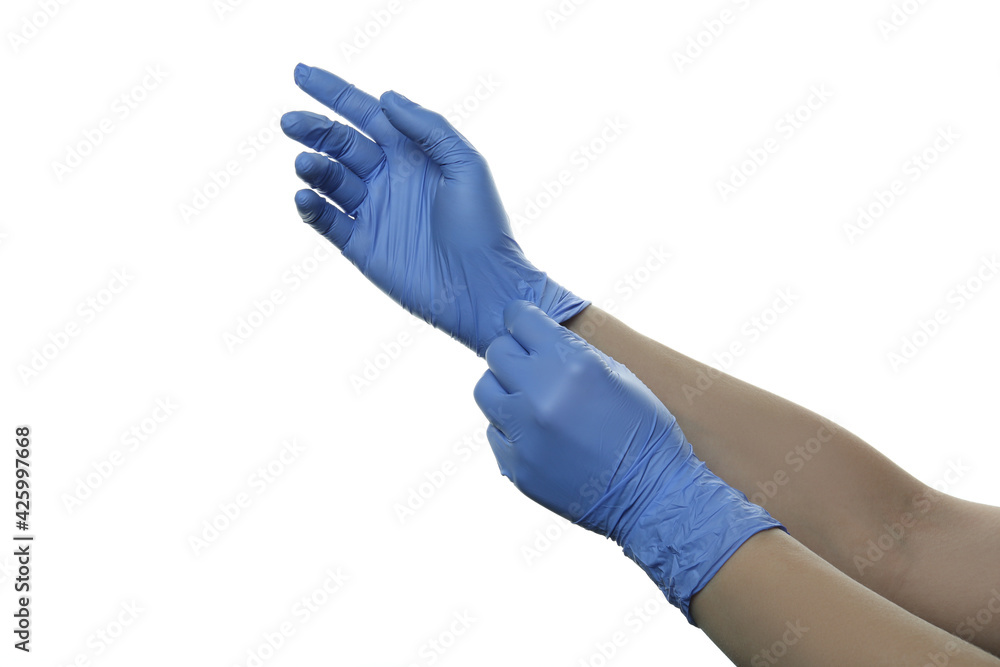 Female hands putting on medical gloves, isolated on white background