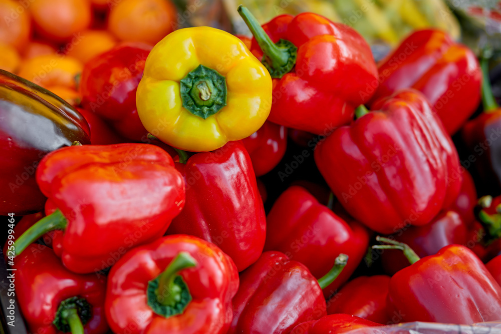 Distinction concept. Stand out from the crowd. Bell pepper background Distinction concept. Stand out from the crowd. Bell pepper background