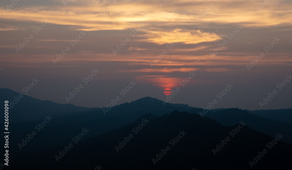 Sunset through the mountain
