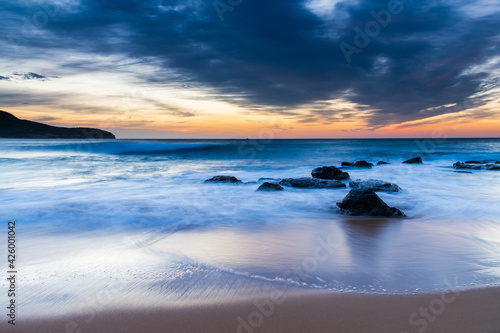 Sunrise at the beach with high cloud