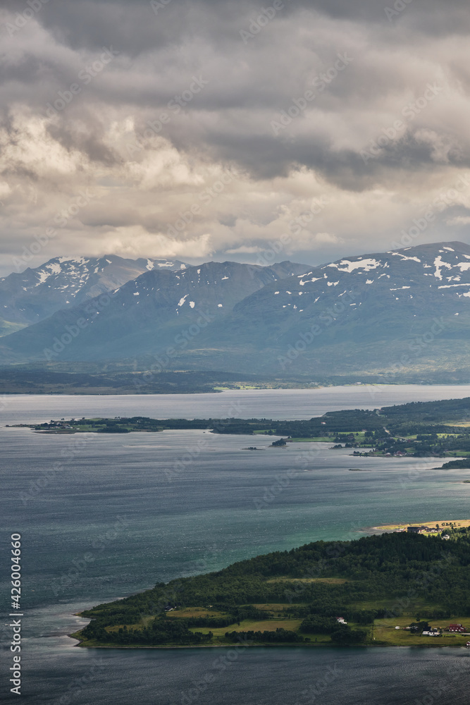 Scenic view of the beautiful landscape of Tromso from the top of a mountain, with a beautiful light