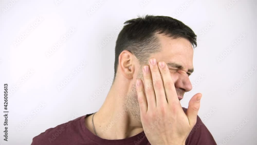 A young guy is hit on the cheeks with a hand in slow motion.A young attractive guy gets a slap in the face from his girlfriend. Slow motion of a blow to the cheek with the palm of the hand. A young guy is hit on the cheeks with a hand in slow motion.A young attractive guy gets a slap in the face from his girlfriend. Slow motion of a blow to the cheek with the palm of the hand.