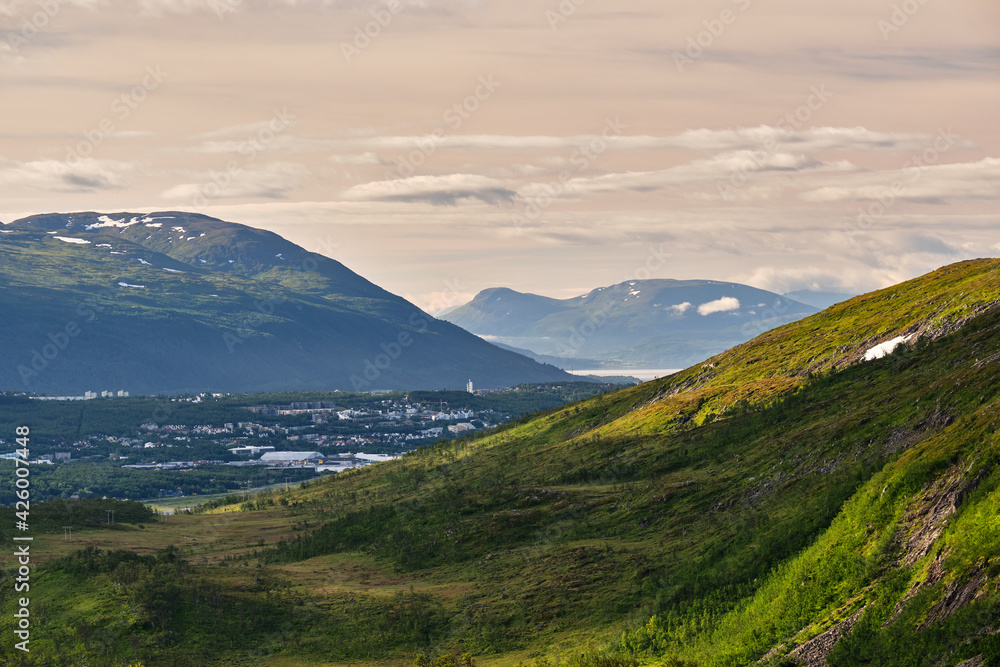 Scenic view of a beautiful sunrise over Tromso Scenic view of a beautiful sunrise over Tromso