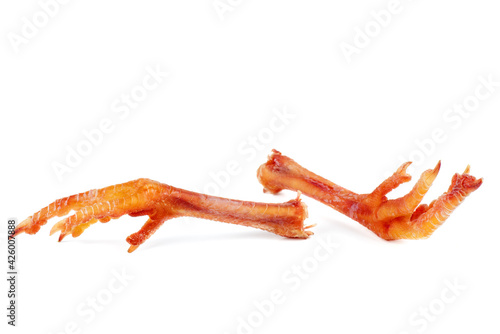 Pair of cured chicken feets isolated on white background