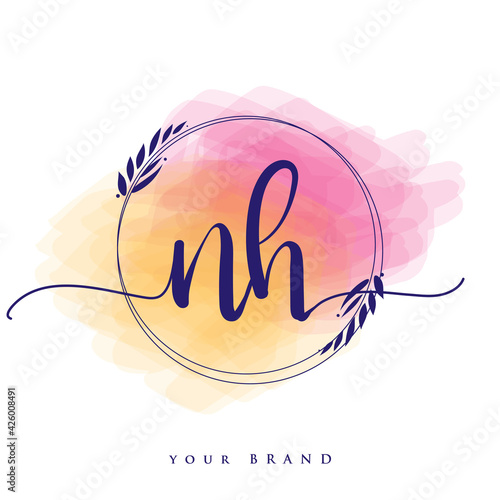 NH Initial handwriting logo. Hand lettering Initials logo branding, Feminine and luxury logo design isolated on colorful watercolor background. photo