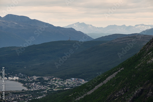 Wonderful view of the city of Tromso from the top of a mountain during a cloudy day