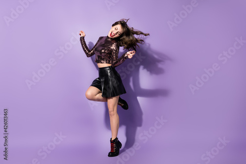Full length body size view of charming chic cheerful thin girl jumping dancing rest isolated over bright violet color background
