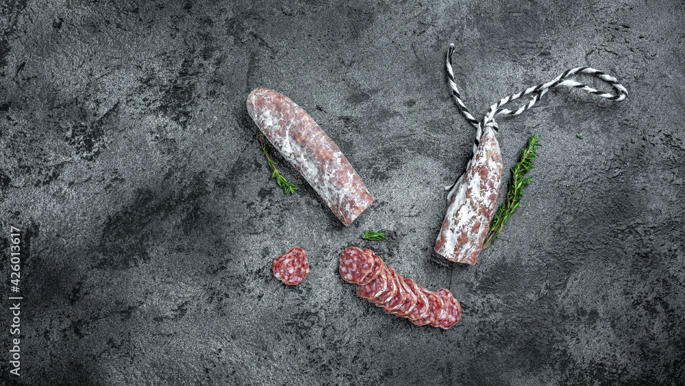 Fueta Fuet Catalan dry cured sausage cut in slices. Traditional Spanish Fuet ...