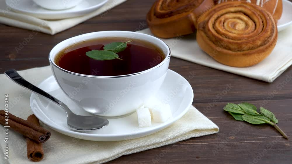 fresh mint leaves to the hot black tea. morning tonic drink for breakfast. fresh mint leaves to the hot black tea. morning tonic drink for breakfast.