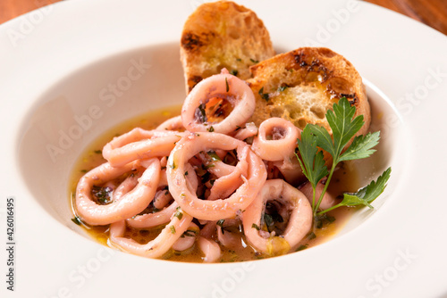 Piatto di calamari in umido alla mediterranea photo