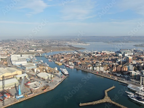 aerial view of Poole harbour and the historic Quay area seen on a sunny calm morning © chris