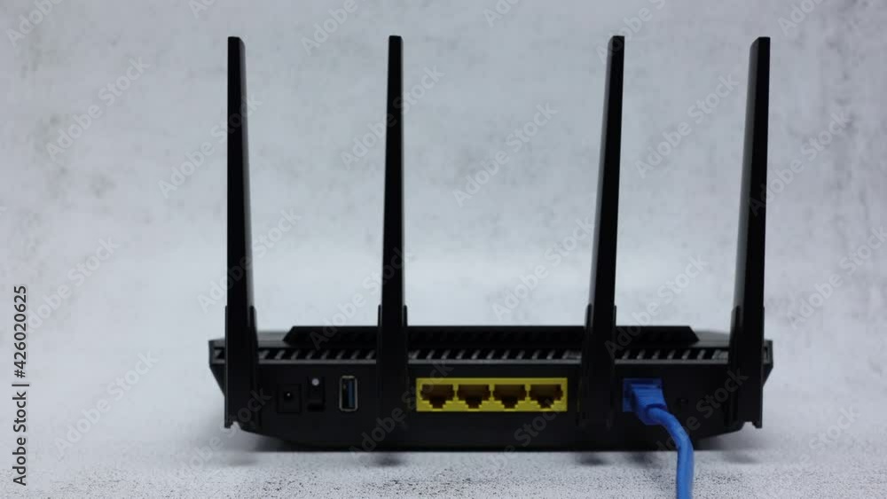Wireless WIFI Router With Blue Patch Cord In WAN Connector On Office ...