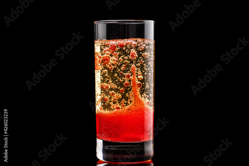 DIY Lava with oil, water and food coloring in glass photo