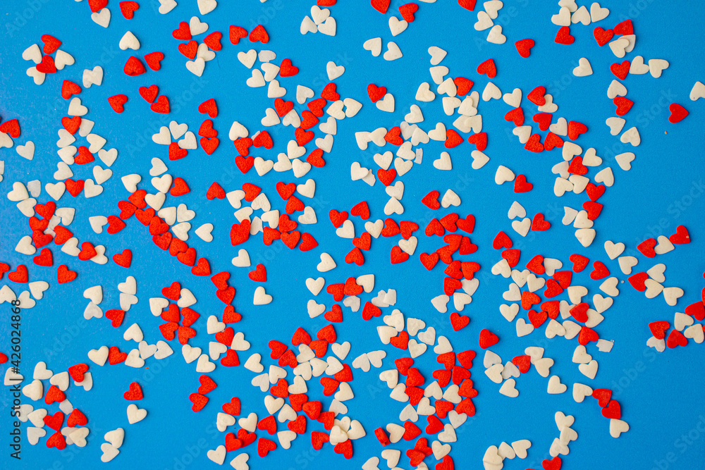 Little colorful hearts on a blue background