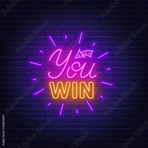 You win neon sign on a brick wall background.