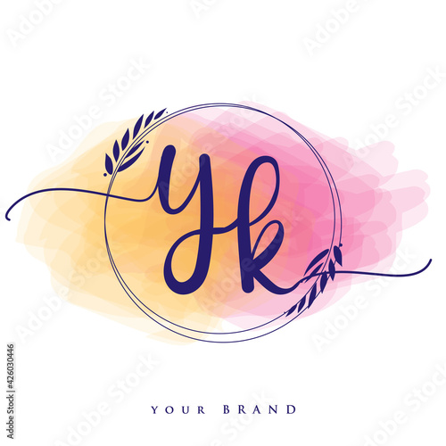 YK Initial handwriting logo. Hand lettering Initials logo branding, Feminine and luxury logo design isolated on colorful watercolor background. photo