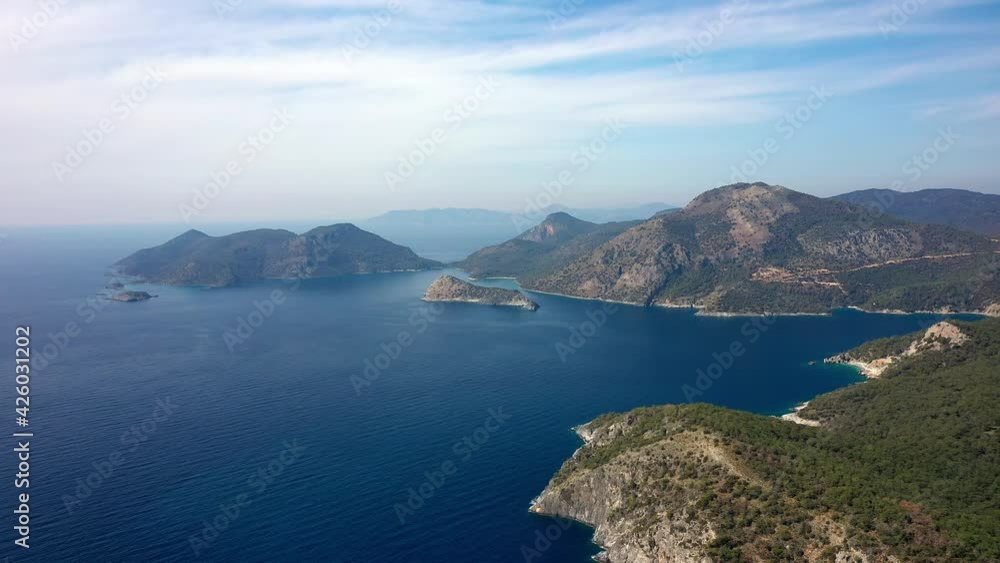 Aerial view of blue lagoon in Oludeniz, Turquoise Coast of southwestern, Fethiye district Turkey. Sunny summer day with clear blue sky. Aerial view 4K. Aerial view of blue lagoon in Oludeniz, Turquoise Coast of southwestern, Fethiye district Turkey. Sunny summer day with clear blue sky. Aerial view 4K.