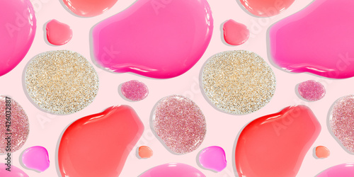 Seamless pattern of pink and glittered nail polish in separate blobs on a pink background